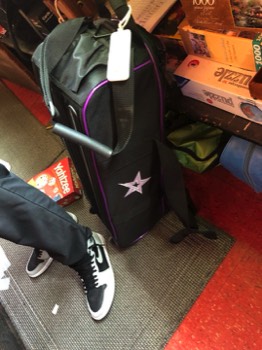 Yes he does carry his own bag!